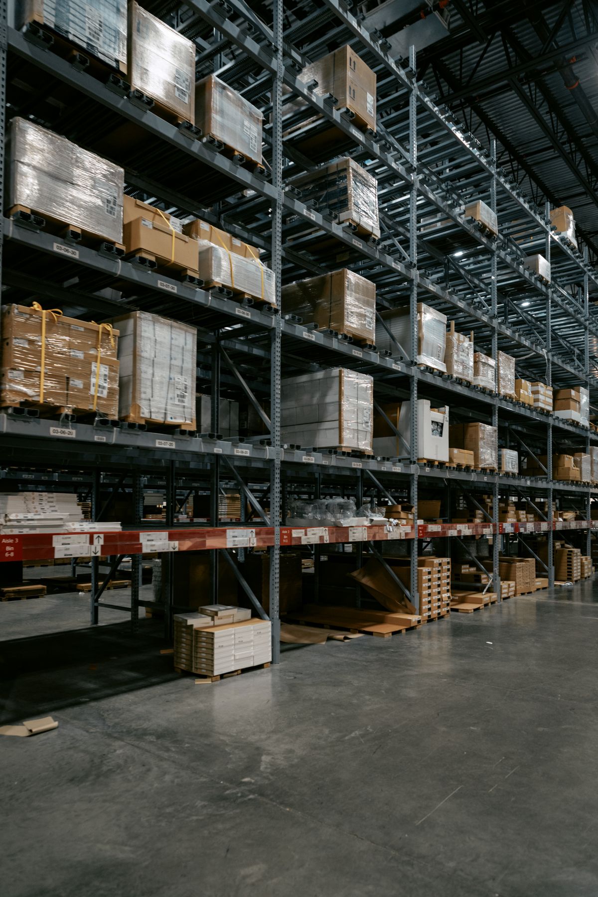 Distribution warehouse with stacked pallets — placeholder photo